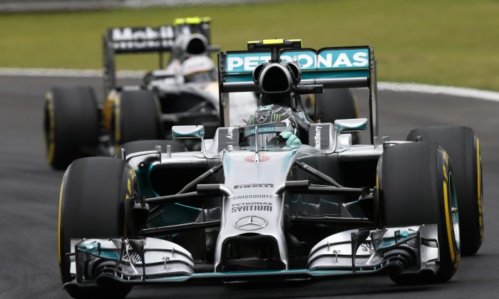 Mercedes driver Nico Rosberg, of Germany, steers his car in the qualifying session for the Formula One Brazilian Grand Prix at the Interlagos race track in Sao Paulo, Brazil, Saturday, Nov. 8, 2014. Rosberg clocked the fastest time (AP Photo/Andre Penner)