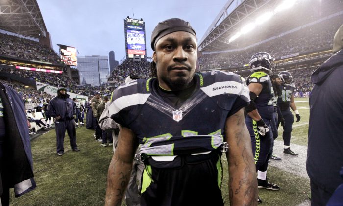 Seattle Seahawks' Marshawn Lynch heads to the locker room late in the second half of an NFL football game against the New York Giants, Sunday, Nov. 9, 2014, in Seattle. The Seahawks won 38-17. (AP Photo/Elaine Thompson)
