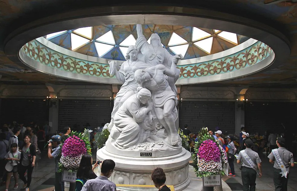 South Koreans visit at National Cemetery during a ceremony marking Korean Memorial Day on June 6, 2014, in Seoul, South Korea. A 73-year-old Los Angeles woman has written a gripping tale of her childhood in Korea. (Chung Sung-Jun/Getty Images) 