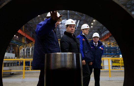 Russian Prime Minister Dmitry Medvedev (2L) accompanied by Dmitry Pumpyansky (L) head of TMK, Russia's largest maker of steel pipes for the oil and gas industry, visit the Seversky Tube Works in the town of Polevskoy, outside Yekaterinburg, Urals, on Oct. 24, 2014. (Ivan Sekretarev/AFP/Getty Images)