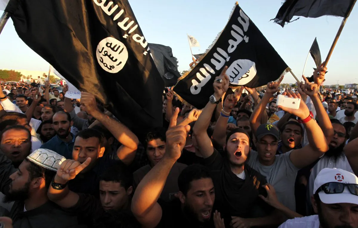 Libyan followers of Ansar al-Shariah Brigades and other Islamic militias, hold a demonstration against a film and a cartoon denigrating the Prophet Muhammad in Benghazi, Libya, on Sept. 21, 2012.   (Mohammad Hannon, File /AP Photo)