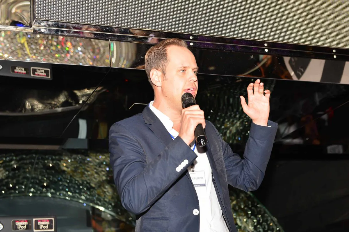 Malte Zeeck, Founder and CEO of the InterNations expatriate club addressing members at a meeting at the Magnum Club Hong Kong on Oct 30, 2014. (Bill Cox/Epoch Times)
