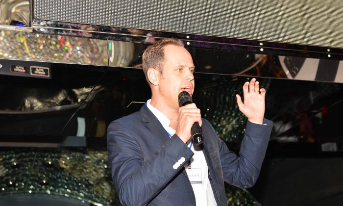 Malte Zeeck, Founder and CEO of the InterNations expatriate club addressing members at a meeting at the Magnum Club Hong Kong on Oct 30, 2014. (Bill Cox/Epoch Times)