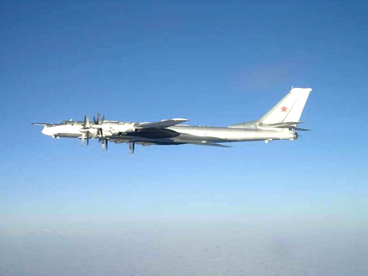 Photo released by the US Navy, one of two Russian Tupolev 95 Bear long rang bomber aircraft is seen near the US Navy aircraft carrier USS Nimitz, south of Japan. (AP Photo/US Navy)
