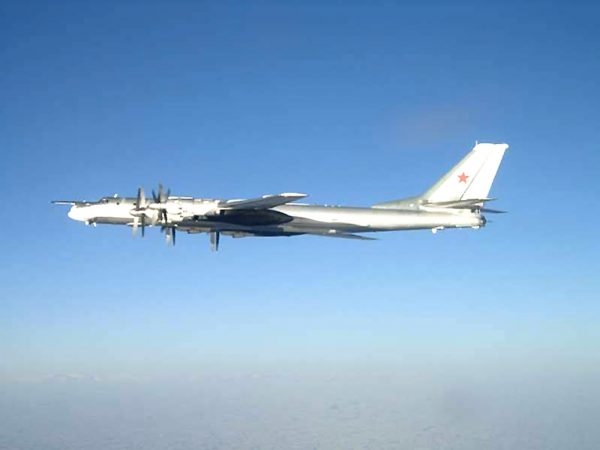 Photo released by the US Navy, one of two Russian Tupolev 95 Bear long rang bomber aircraft is seen near the US Navy aircraft carrier USS Nimitz, south of Japan. (AP Photo/US Navy)