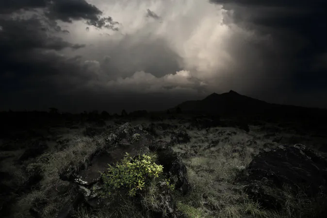 A file photo of dark clouds over a volcanic valley. (Shutterstock) 