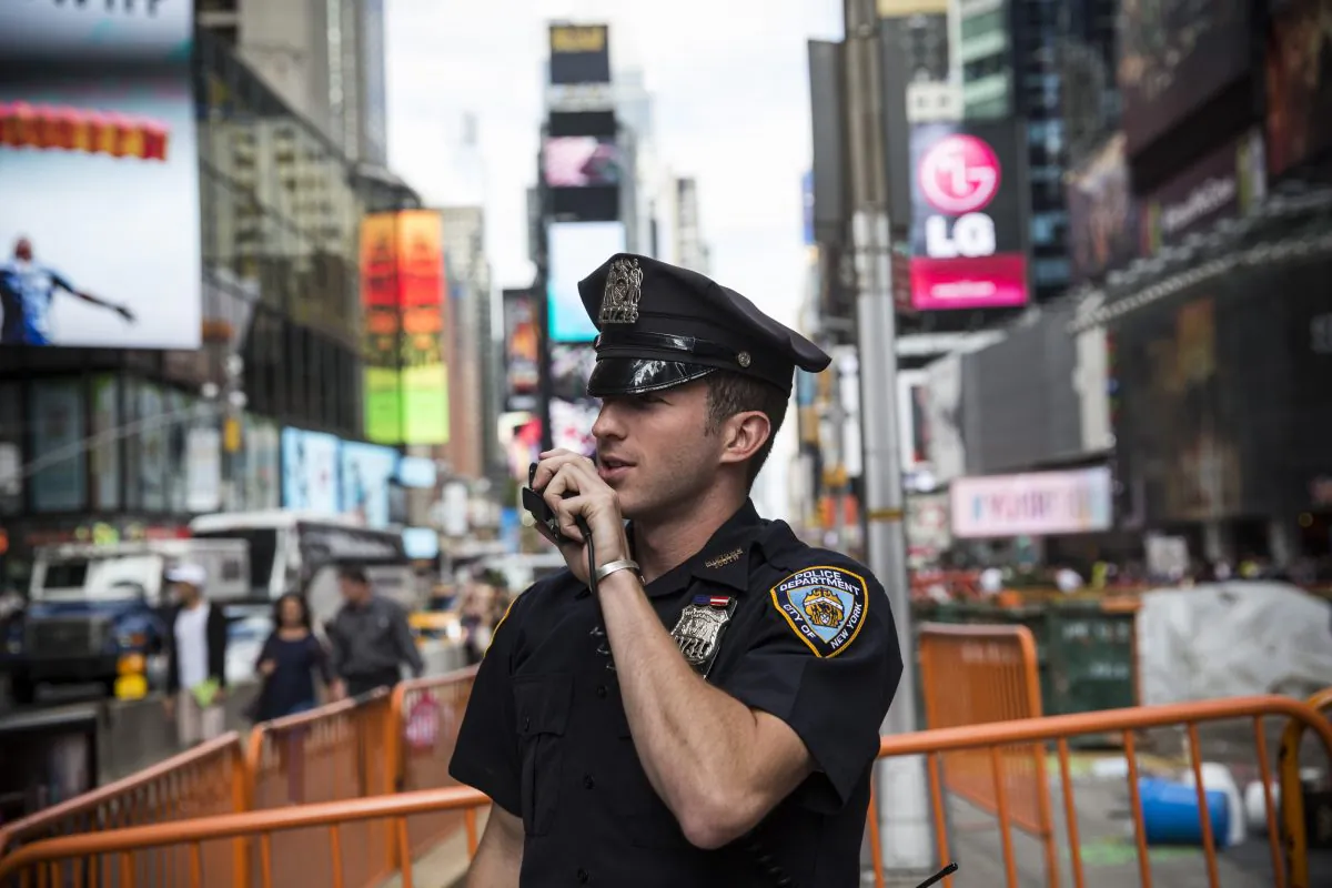 A New York Police Department (NYPD) officer speaks on his radio in Times Square on September 22, 2013 in New York City. (Andrew Burton/Getty Images)