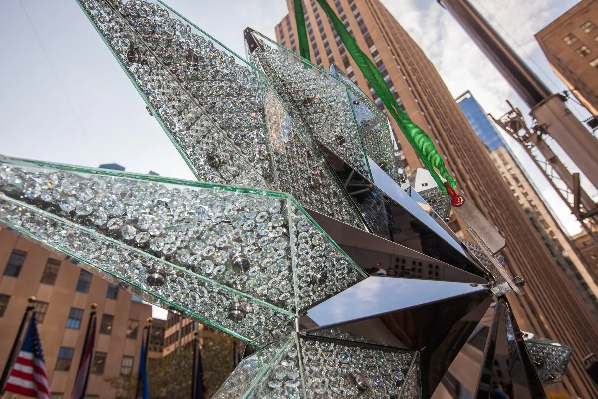 A 550-pound Swarovski crystal star is prepared for its ascent to the top of the Christmas tree at Rockefeller Plaza in Manhattan, New York, on Nov. 13, 2014. (Petr Svab/Epoch Times)