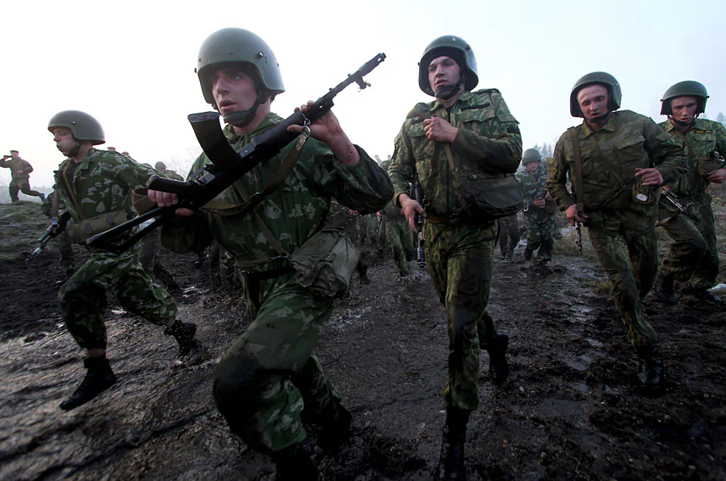 Belarus Interior Ministry troops soldiers take part in the qualifying examinations for the 'Madder Beret' headdress outside Minsk, on Nov. 4, 2014. (Sergei Gapon/AFP/Getty Images)