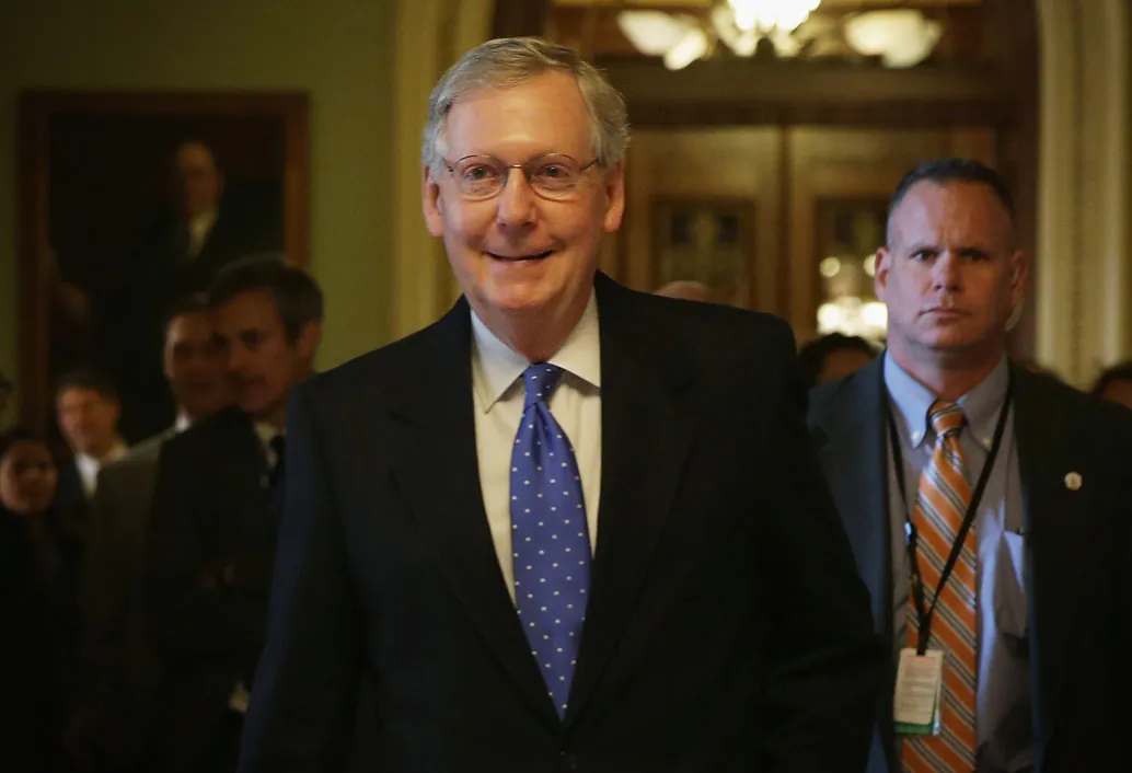 US Senate Republican leader Sen. Mitch McConnell (R-KY) (C) arrives at his office at the US Capitol in the morning on Nov. 13, 2014, in Washington, DC. (Alex Wong/Getty Images)