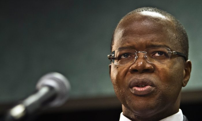 Brooklyn District Attorney Ken Thompson speaks during a press conference, Wednesday Oct. 15, 2014 in New York. Thompson launched an investigation of the Gate Avenue Mafia in September of 2013, the same month he took office as District Attorney. (AP Photo/Bebeto Matthews)