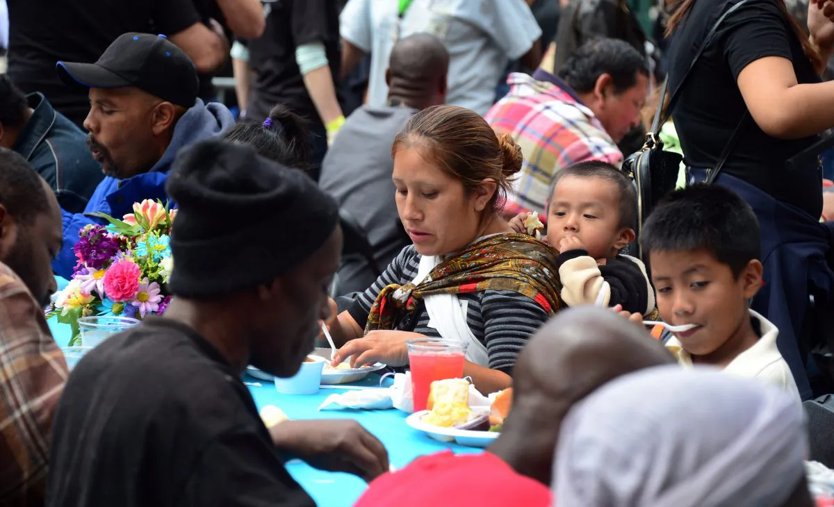 Homeless people eat a meal hosted by the LA Mission in Los Angeles on April 18, 2014. (Frederic J. Brown/AFP/Getty Images)