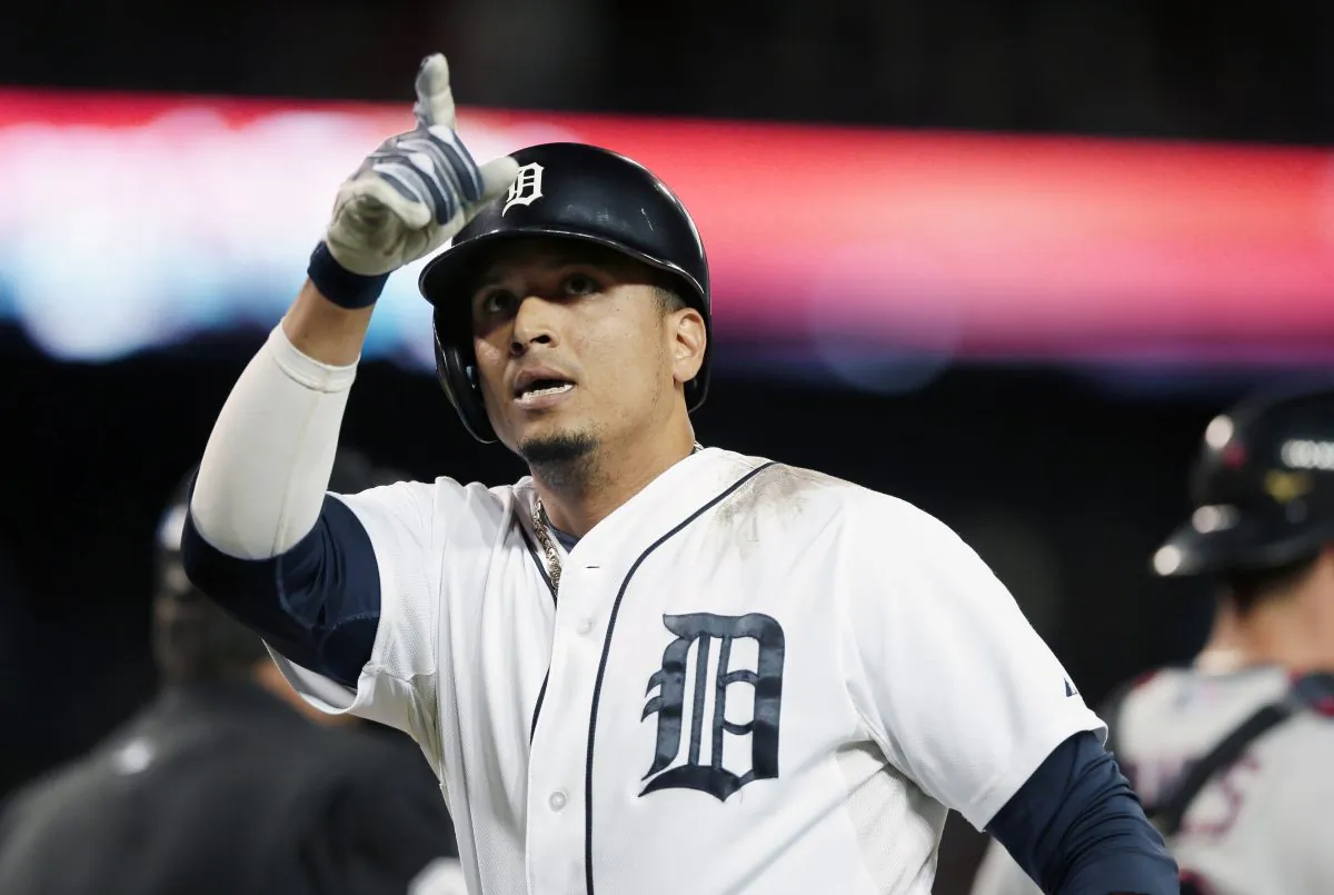 FILE - In this Sept. 13, 2014, file photo Detroit Tigers designated hitter Victor Martinez points to the stands after his solo home run during the fourth inning of a baseball game against the Cleveland Indians in Detroit. A person with knowledge of the deal says the Tigers have agreed to a $68 million, four-year contract with slugger Victor Martinez. The person spoke on condition of anonymity to The Associated Press because the agreement has not been announced. (AP Photo/Carlos Osorio)