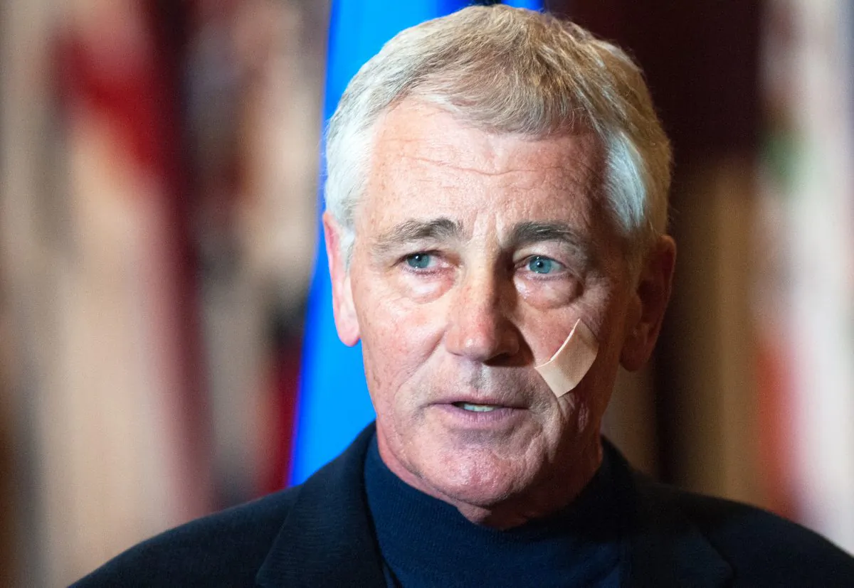 Secretary of Defense Chuck Hagel addresses the media at the Airman's Event during his visit to Minot Air Force Base, N.D., Friday, Nov. 14, 2014. The Pentagon will spend an additional $10 billion to correct deep problems of neglect and mismanagement within the nation's nuclear forces, Hagel declared Friday, pledging firm action to support the men and women who handle the world's most powerful and deadly weapons. (AP Photo/Kevin Cederstrom)