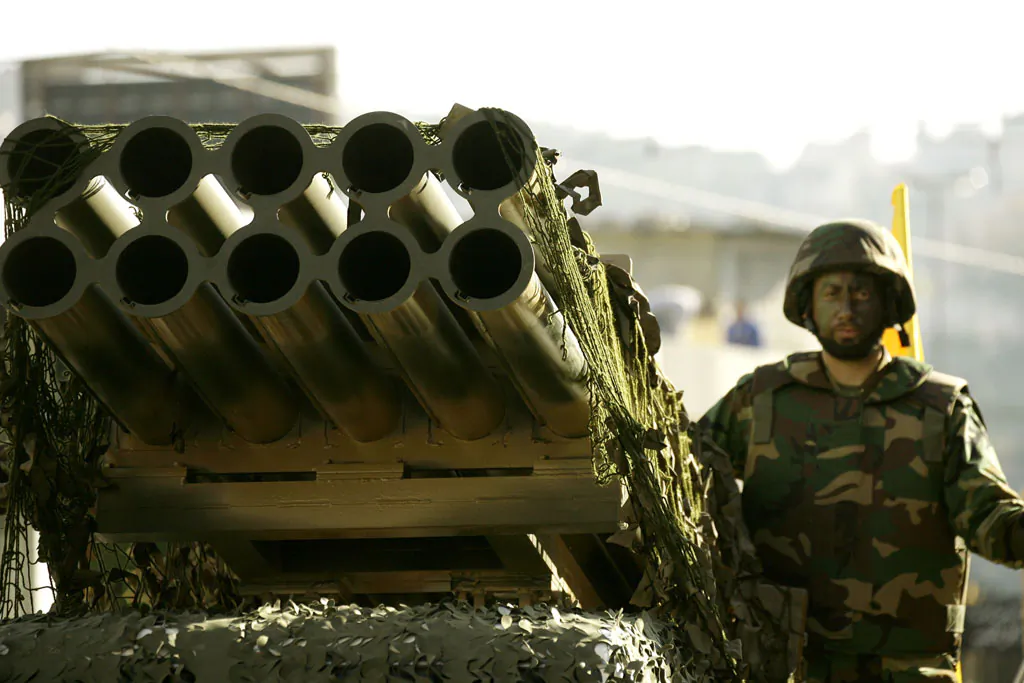 A member of Lebanon's militant Shiite Muslim movement Hezbollah stands on a pick-up truck mounted with a multiple rocket launcher during a parade in the southern city of Nabatiyeh on Nov. 7, 2014, to mark the 13th day of Ashura, where believers mourn the killing of the Prophet Mohammed's grandson, Imam Hussein, during the battle of Karbala in central Iraq in the seventh century. (Mahmoud Zayyat/AFP/Getty Images)