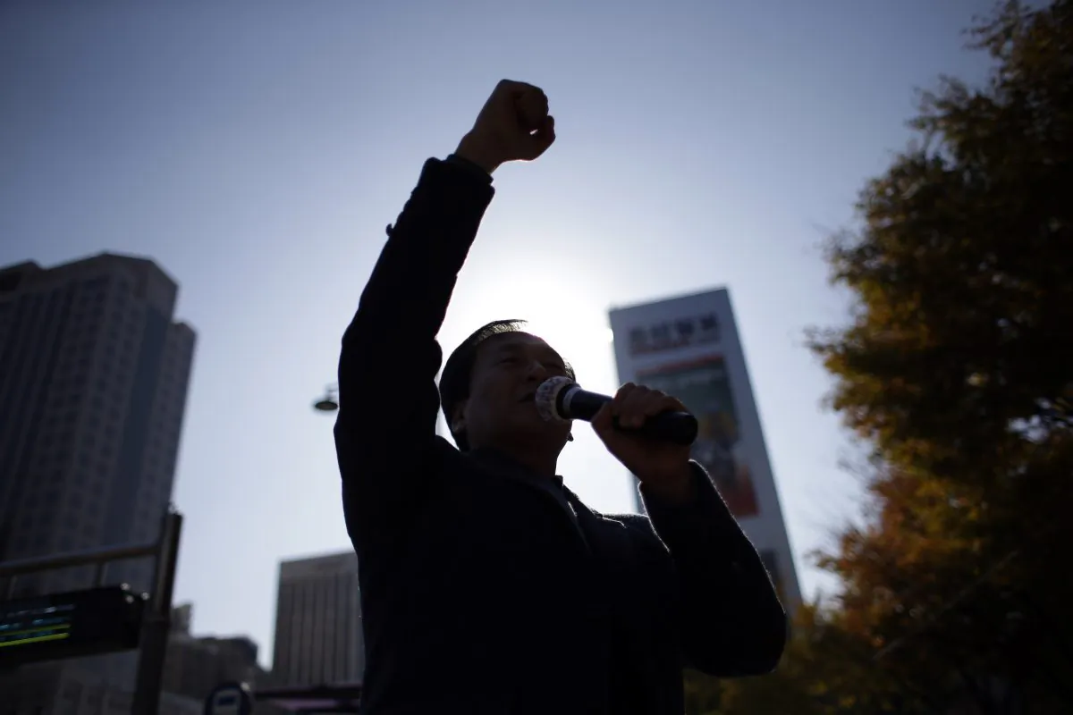 North Korean defector Kim Seong-Min, the head of Free North Korea Radio, shouts slogans during a rally to improve human rights condition in North Korea, in Seoul, South Korea, on Nov. 14, 2014. Kim has worked to help North Koreans bolster their reports by smuggling in illegal cellphones and camcorders for them.(AP Photo/Lee Jin-man)