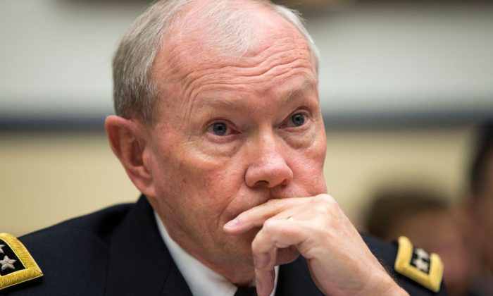 Joint Chiefs Chairman Gen. Martin Dempsey listens on Capitol Hill in Washington, Thursday, Nov. 13, 2014, while testifying before the House Armed Services committee hearing on the Islamic State group. (AP Photo/Evan Vucci)