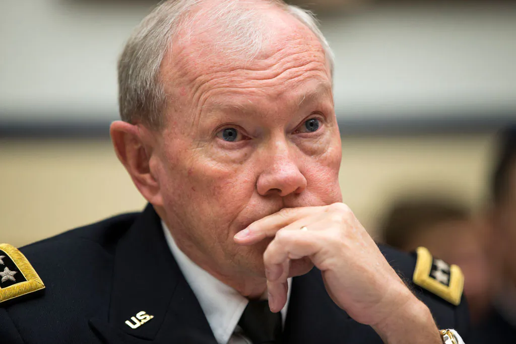 Joint Chiefs Chairman Gen. Martin Dempsey listens on Capitol Hill in Washington, Thursday, Nov. 13, 2014, while testifying before the House Armed Services committee hearing on the Islamic State group. (AP Photo/Evan Vucci)