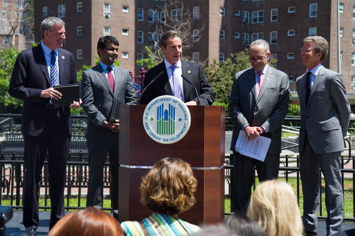 New York Gov. Andrew Cuomo (C) speaks at the announcement of the winning proposals and funding for the Rebuild by Design competition, in Manhattan on June 2, 2014. Joining Cuomo is N.Y. Mayor Bill de Blasio (L) and Zia Khan (2nd L) of the Rockefeller Foundation, U.S. Sen. Charles Schumer (2nd R), and U.S. Department of Housing and Urban Development Secretary Shaun Donovan (R). (Benjamin Chasteen/Epoch Times)