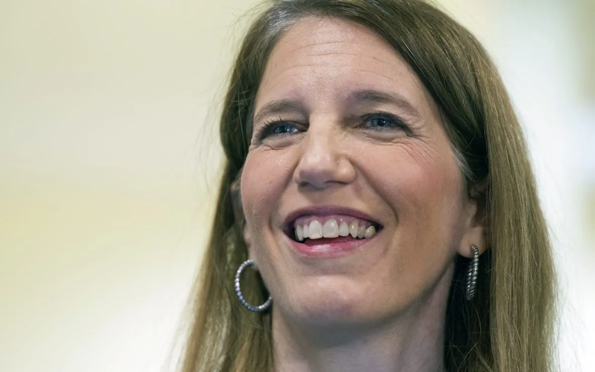 Health and Human Services Secretary Sylvia Burwell smiles while answering a reporters question following her tour of the Greater Prince William Community Health Center, Evergreen Terrace Site, in Manassas, Va., Saturday, Nov. 15, 2014. The second sign-up season under President Barack Obama’s health overhaul starts Saturday with hopes that consumers will have a positive experience this time and fears that entrenched political opposition and renewed legal challenges may yet collapse the program. (AP Photo/Cliff Owen)