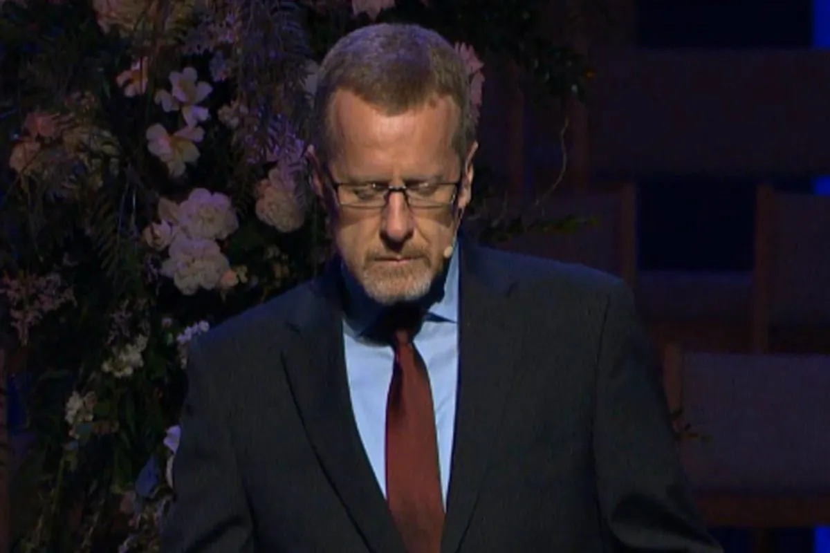 This image from the memorial video for Ashley Picco and her son Lennon James shows Randy Roberts leading a prayer at the beginning of the service Saturday, Nov. 15, 2014, at Loma Linda University Church in Loma Linda, Calif. (AP Photo/Loma Linda University Church, Picco Memorial)