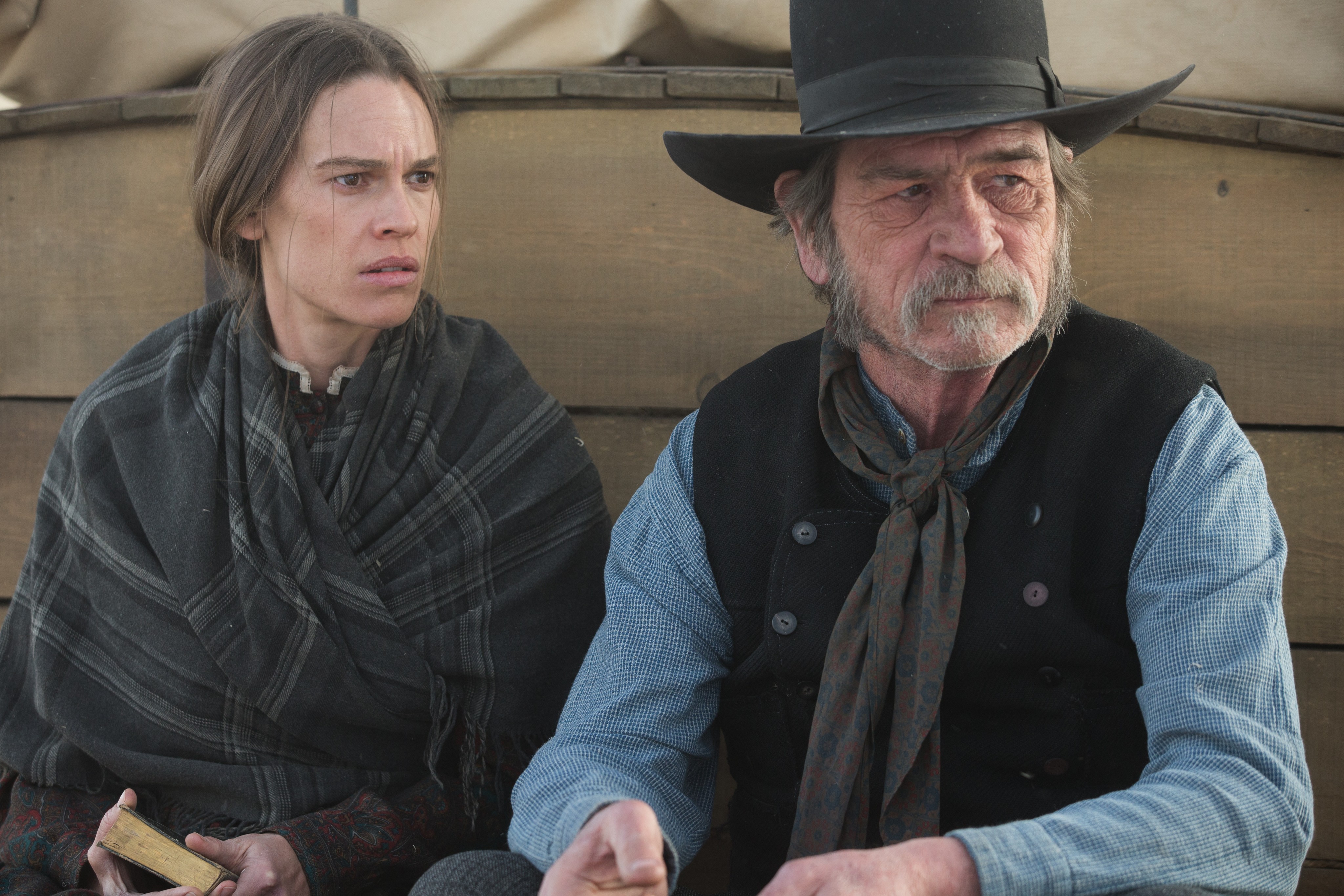 man and woman on wagon in the Homesman
