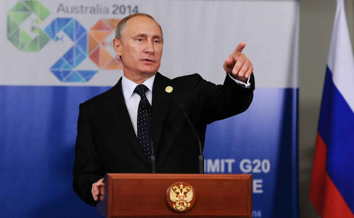 Russian President Vladimir Putin speaks to the media before departing from the G-20 summit in Brisbane, Australia, Nov. 15, 2014. Russian President Vladimir Putin made an early exit on Sunday from a two-day summit of world leaders where he was roundly criticized over Russia's escalating aggression in Ukraine, but brushed off suggestions that he had felt pressured. (AP Photo/RIA-Novosti, Mikhail Klimentyev, Presidential Press Service)