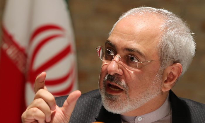 In this Tuesday, July 15, 2014, photo, Iranian Foreign Minister Mohammad Javad Zarif speaks to the media after closed-door nuclear talks on Iran take place in Vienna, Austria. (AP Photo/Ronald Zak)