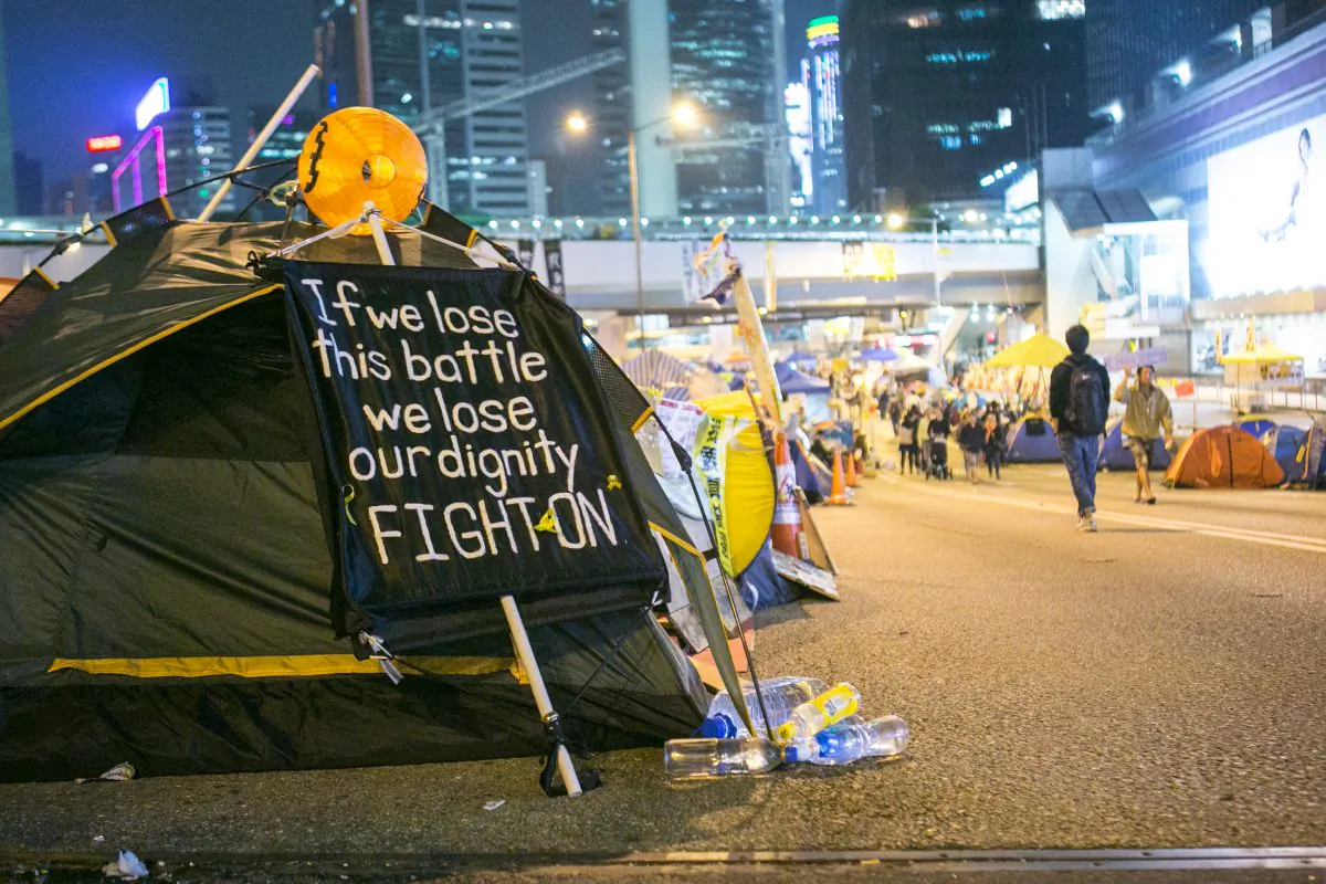 A tent with a sign on it is inside the main area of the Admiralty protest area on Nov. 17, 2014. (Benjamin Chasteen/Epoch Times)