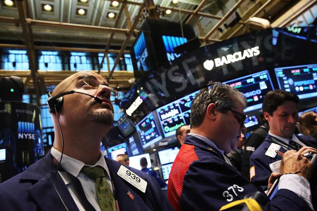 Traders work on the floor of the New York Stock Exchange on Nov. 13, 2014, in New York City. Financial markets are facing almost diametrically different challenges from what they faced in the 1970s. (Spencer Platt/Getty Images)
