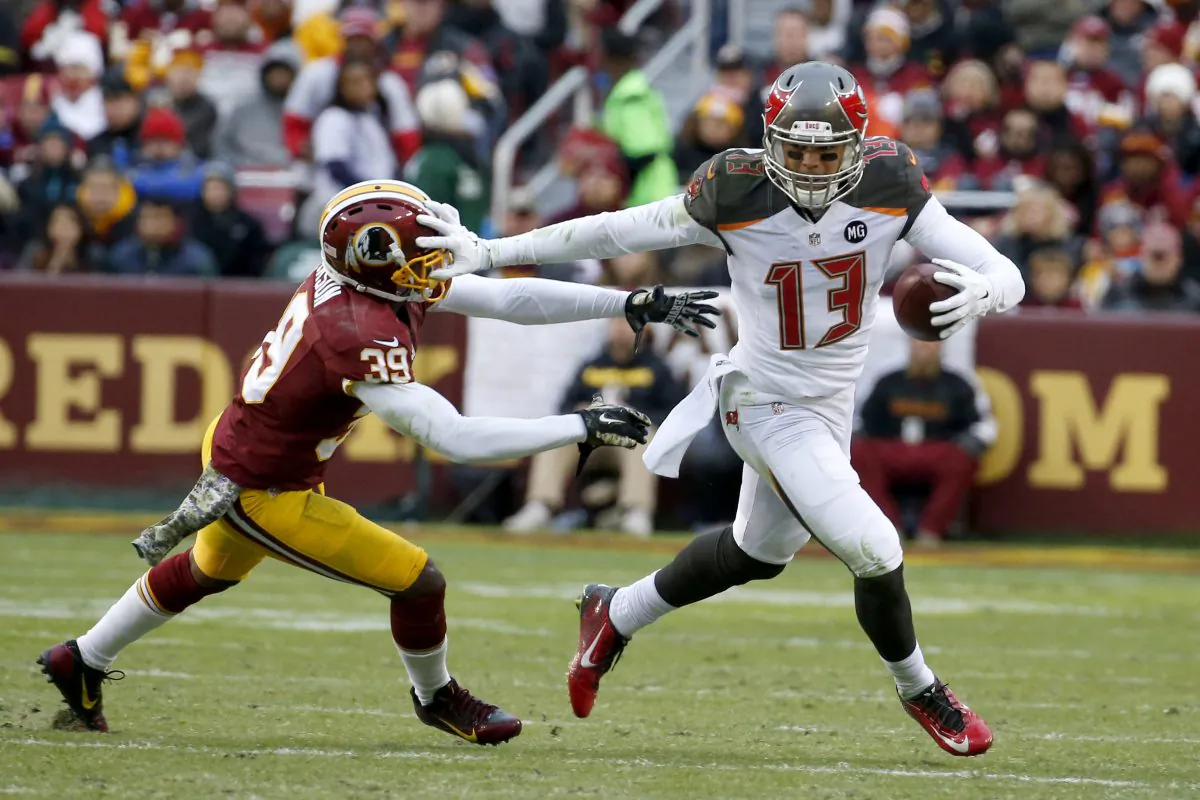 Tampa Bay Buccaneers wide receiver Mike Evans (13) pushes Washington Redskins cornerback David Amerson (39) away during the second half of an NFL football game in Landover, Md., Sunday, Nov. 16, 2014. (AP Photo/Alex Brandon)