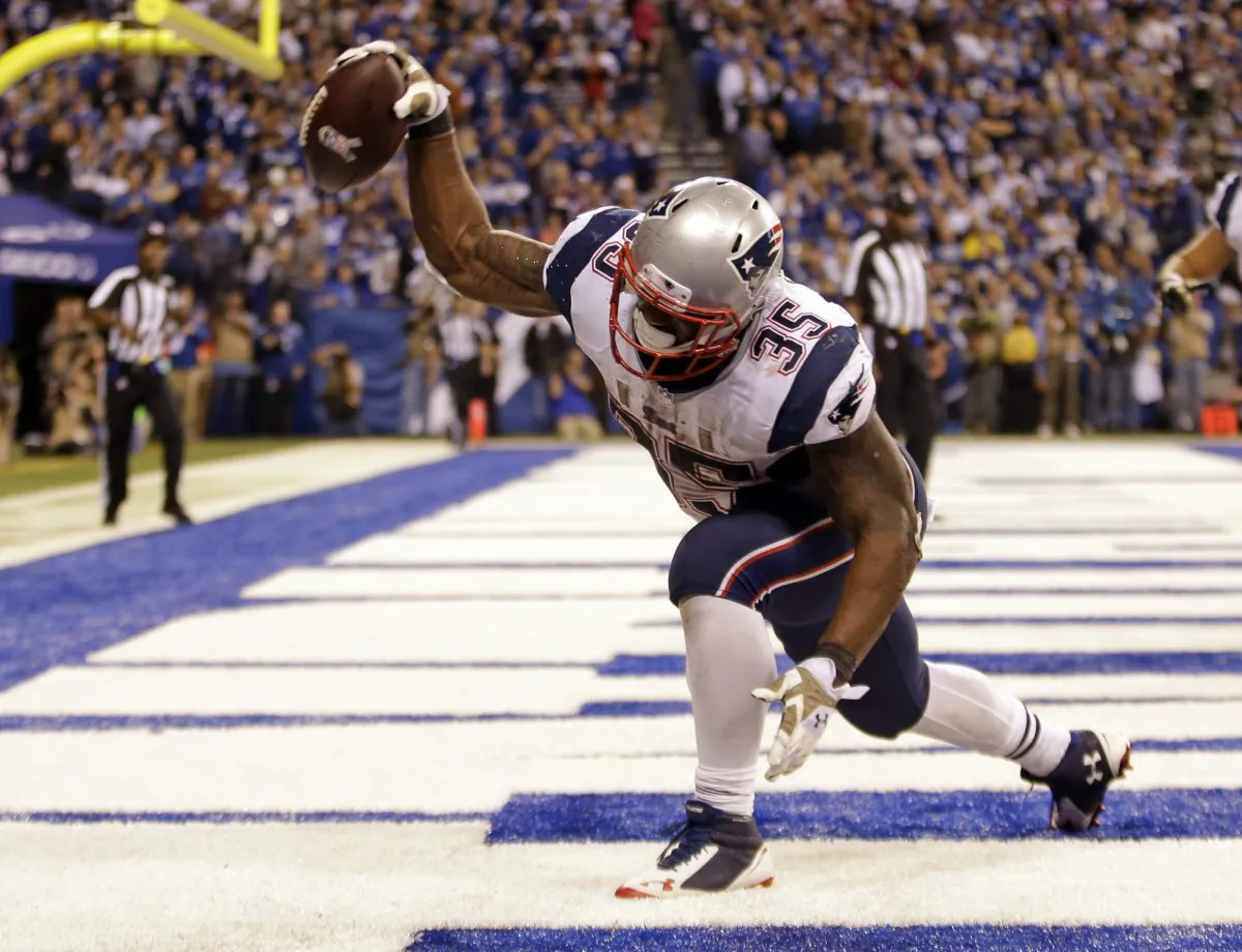 New England Patriots running back Jonas Gray celebrates a touchdown against the Indianapolis Colts during the second half of an NFL football game in Indianapolis, Sunday, Nov. 16, 2014. (AP Photo/AJ Mast)