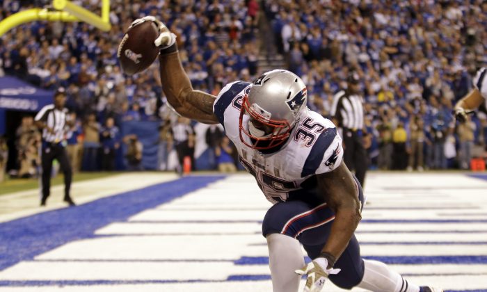 New England Patriots running back Jonas Gray celebrates a touchdown against the Indianapolis Colts during the second half of an NFL football game in Indianapolis, Sunday, Nov. 16, 2014. (AP Photo/AJ Mast)