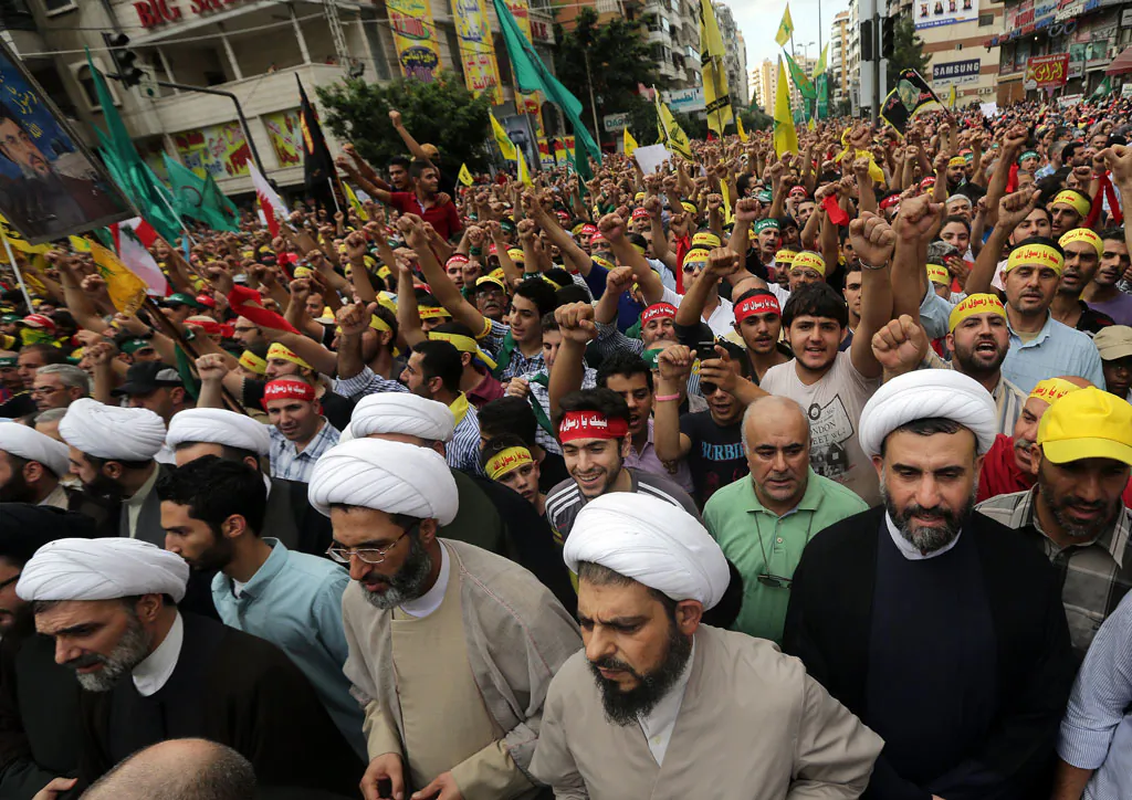 Shiite Muslim clerics and supporters of Lebanon's Hezbollah group march during a rally in southern Beirut to denounce a film mocking Islam on Sept. 17, 2012. (Joseph Eid/AFP/GettyImages)