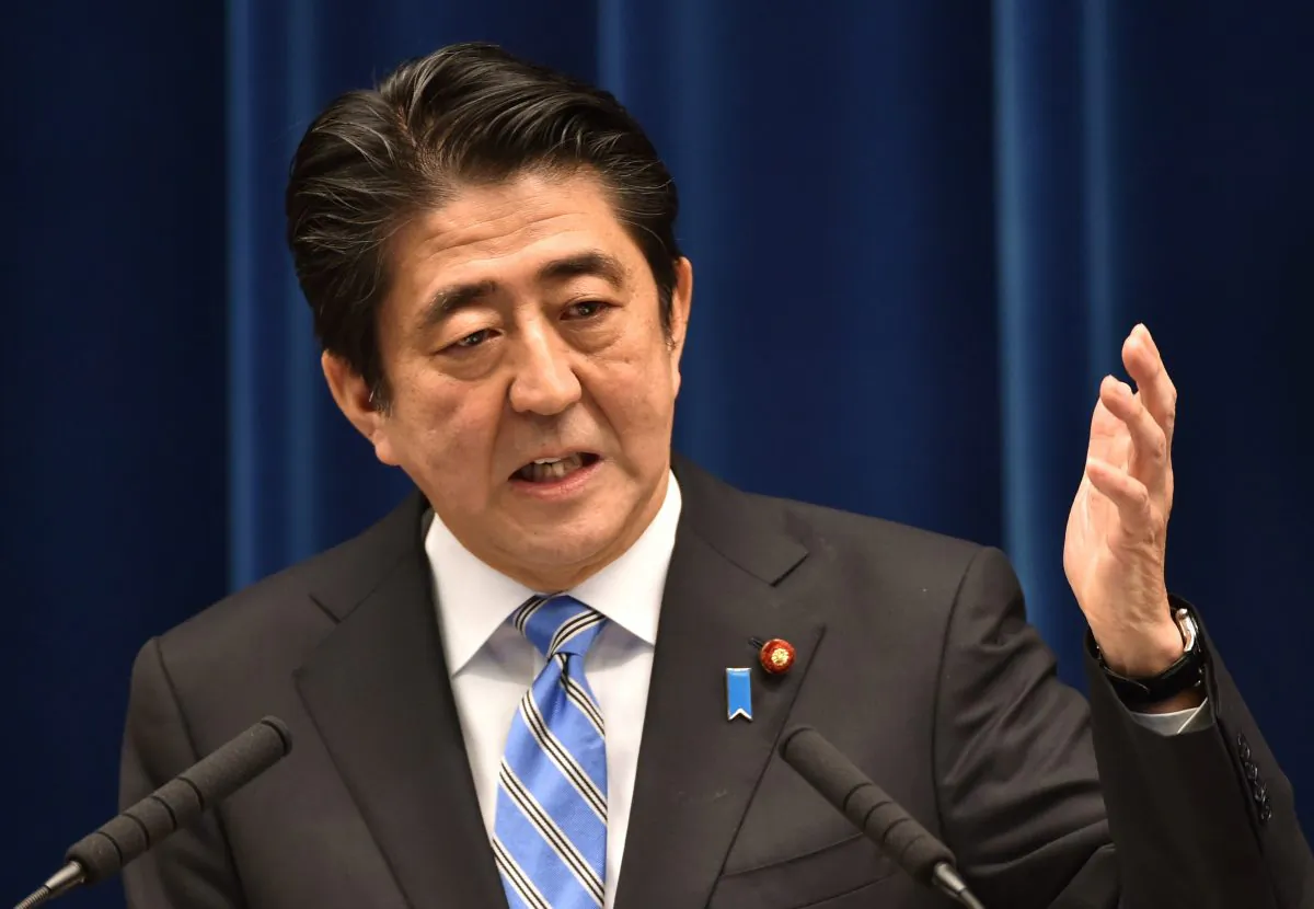 Japan's Prime Minister Shinzo Abe speaks during a press conference at his official residence in Tokyo on Nov. 18, 2014. Abe said November 18 he was delaying an expected sales tax rise and dissolving the lower house of parliament after figures showed Japan was in a recession. (Kazuhiro Nogi/AFP/Getty Images)