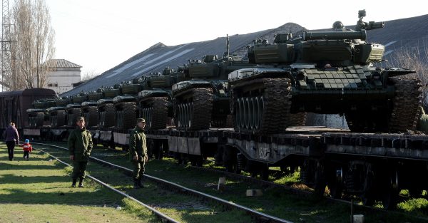 Russian soldiers stand near a trainload of their modified T-72 tanks after their arrival in Gvardeyskoe railway station near the Crimean capital Simferopol, on March 31, 2014. (Olga Maltseva/AFP/Getty Images)