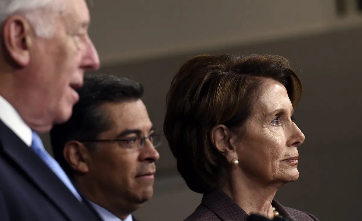 House Minority Leader Nancy Pelosi of Calif. (R) and Chairman of the Democratic Caucus Rep. Xavier Becerra, D-Calif. (C) listen as House Minority Whip Steny Hoyer of Md. (L) speaks during a news conference on Capitol Hill in Washington, Tuesday, Nov. 18, 2014, to introduce the Democratic leadership team for the 114th Congress. (AP Photo/Susan Walsh)