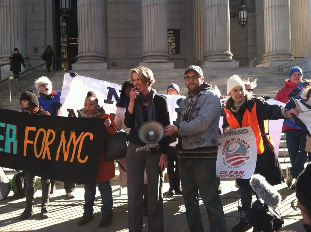 Former New York gubernatorial candidate Zephyr Teachout (L) and filmmaker Josh Fox at a rally protesting the Keystone XL Pipeline in downtown Manhattan, New York on Tuesday, Nov. 18, 2014. On Tuesday evening, the U.S. Senate was expected to vote on whether to approve the next phase of the pipeline's construction, which will bring crude oil from Canadian tar sands to refineries along the U.S. Gulf Coast. (Annie Wu/Epoch Times)