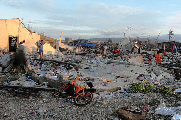 Homes destroyed by Typhoon Bopha in the Philippines in 2012. Rising sea levels are worsening storm surges of hurricanes. In addition, some research shows that global warming may be making hurricanes more powerful. Photo by: Rhett A. Butler. 