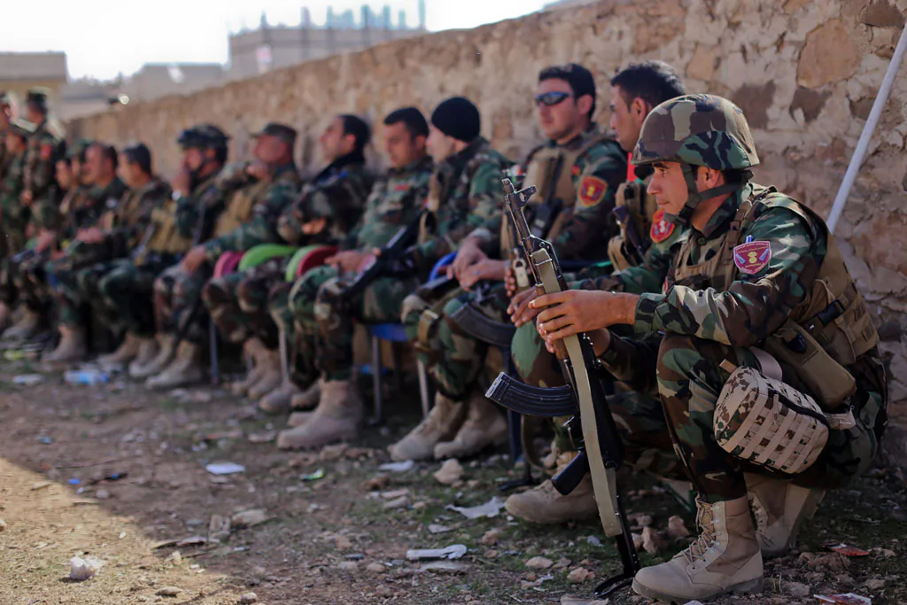 Kurdish Peshmerga fighters rest during fighting against Islamic State (IS) group on Nov. 8, 2014, in the Syrian besieged border town of Ain al-Arab (known as Kobani by the Kurds). US-led air strikes hit jihadist positions in the north and east of Syria, including an oil field, the Syrian Observatory for Human Rights said. (Ahmed Deeb/AFP/Getty Images)