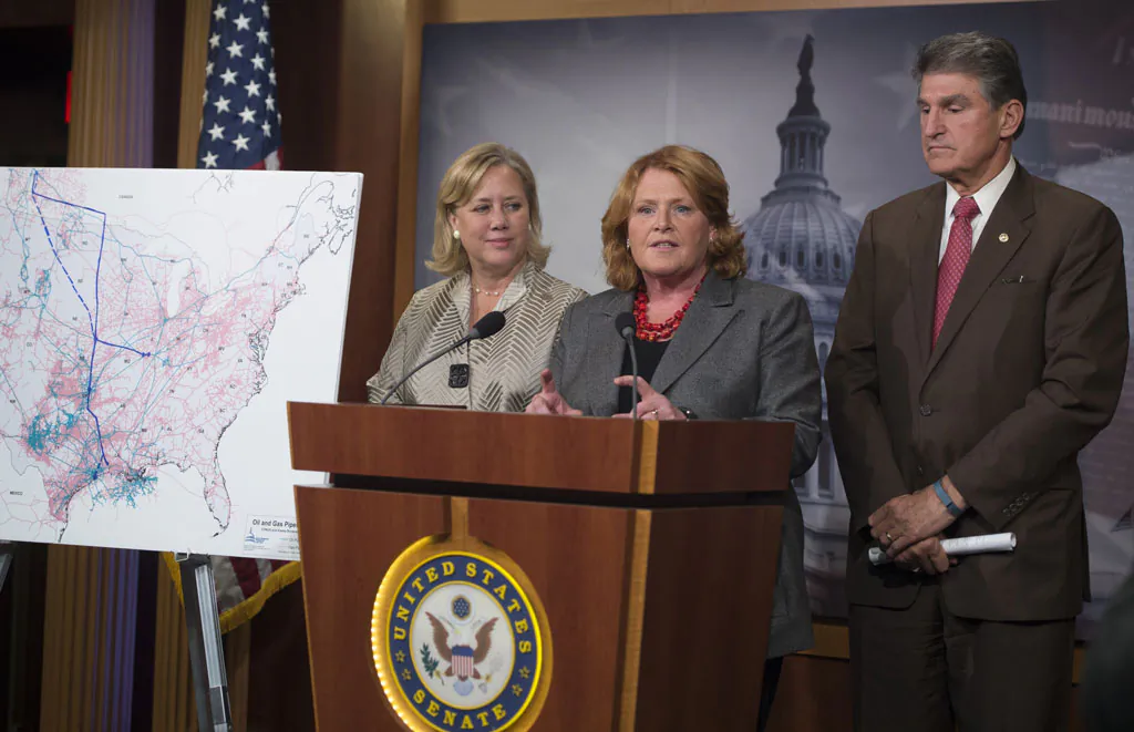 Senator Heidi Heitkamp (D-ND), center, speaks alongside other Senators in a 2014 file photo. (Saul Loeb/AFP/Getty Images)