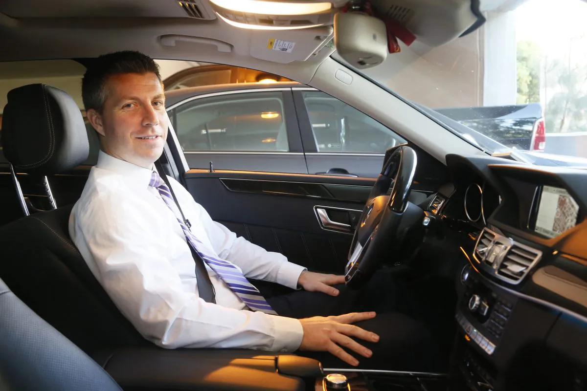 University of Southern California professor Jeffery Miller sits in his car in Los Angeles on Nov. 18, 2014. Miller develops software that will help the cars of the future drive themselves. (AP Photo/Nick Ut)