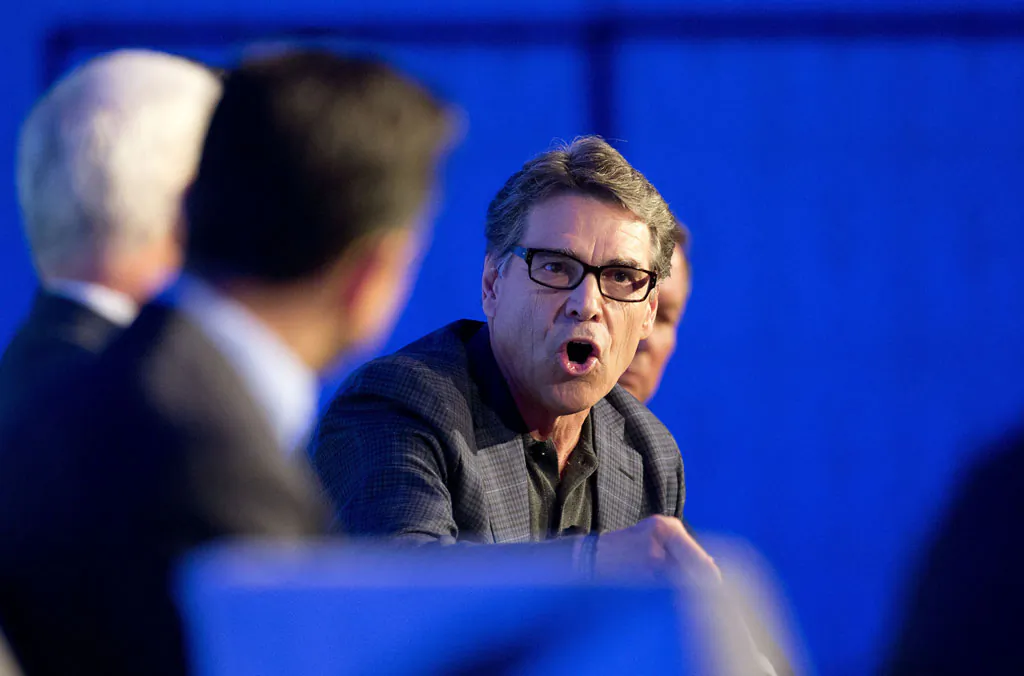 Texas Gov. Rick Perry talks about the costs of illegal immigration in his state during a press conference at the Republican governors conference in Boca Raton, Fla., Wednesday, Nov. 19, 2014. The organization's annual conference began Wednesday in a luxury oceanside resort where the nation's Republican governors are celebrating their party's recent success in the midterm elections while privately jockeying for position as the 2016 presidential contest looms. (AP Photo/J Pat Carter)