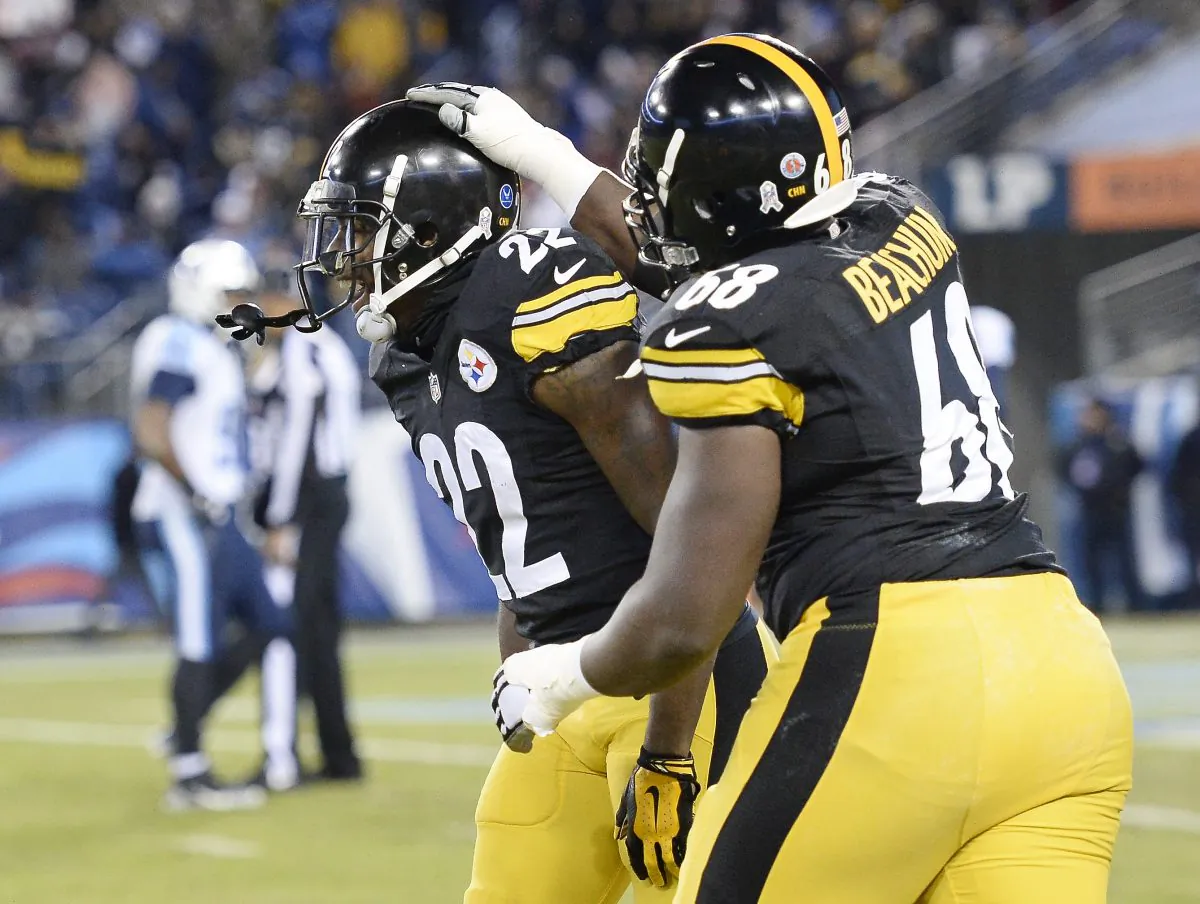 Pittsburgh Steelers cornerback William Gay (22) celebrates with Kelvin Beachum (68) after Gay scored a touchdown on a 28-yard interception return against the Tennessee Titans in the first half of an NFL football game Monday, Nov. 17, 2014, in Nashville, Tenn. (AP Photo/Mark Zaleski)