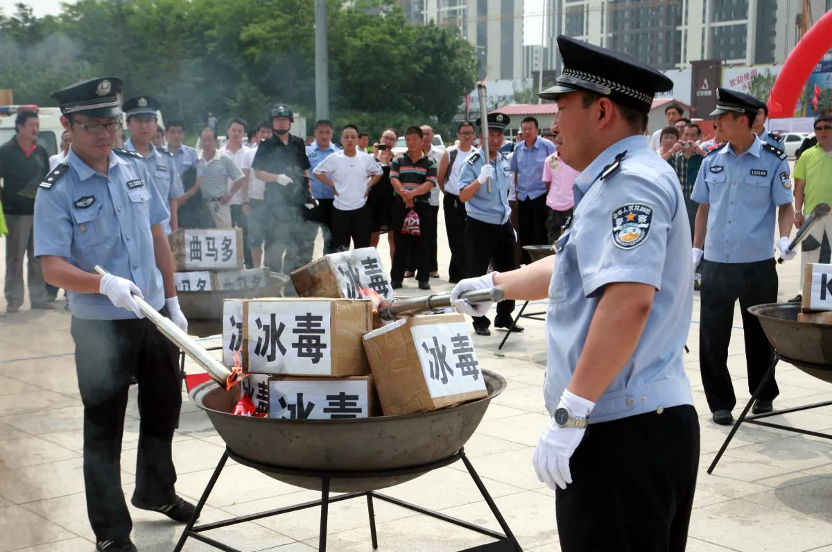 Policemen prepare to incinerate drugs on the International Day Against Drug Abuse and Illicit Trafficking on June 26, 2012 in Shenyang, China. Drug use in China has rapidly increased over the past two years, according to the Ministry of Public Security. (ChinaFotoPress/Getty Images)