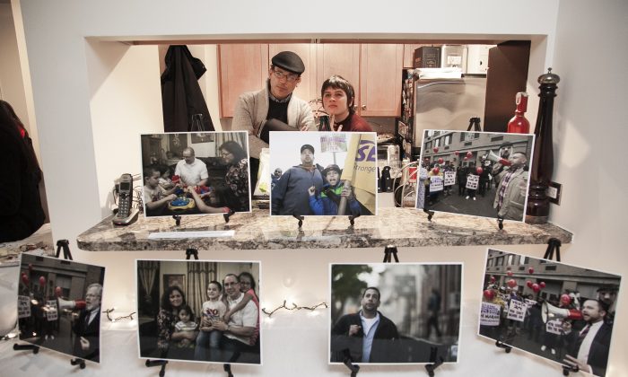 People at a pop-up exhibit on the lives of building workers in Chelsea, hosted at Lowell Kern's apartment at 520 W 23rd Street, on Nov. 18, 2014. (Samira Bouaou/Epoch Times)