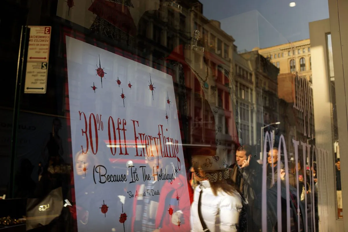 People shop along Broadway on Dec. 2, 2013, in New York City. According to the National Retail Federation, retail spending over the Thanksgiving weekend fell for the first time in at least seven years. (Spencer Platt/Getty Images)