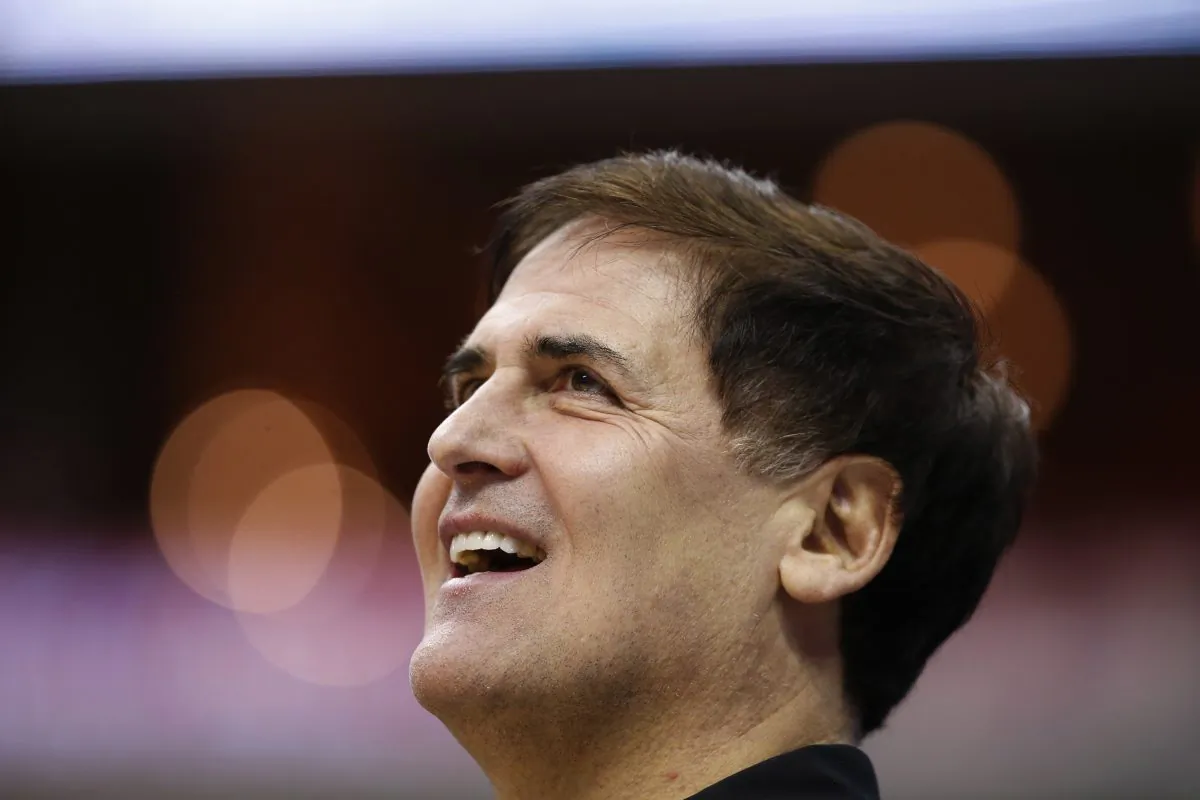 Dallas Mavericks owner Mark Cuban stands on the court before an NBA basketball game against the Washington Wizards, Wednesday, Nov. 19, 2014, in Washington. (AP Photo/Alex Brandon)