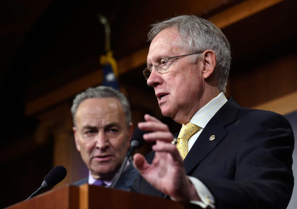 Senate Chales Schumer (D-N.Y.) listens at left as Senate Majority Leader Harry Reid of Nev. speaks during a news conference on immigration reform, Nov. 20, 2014, on Capitol Hill in Washington, DC. (AP Photo/Susan Walsh)