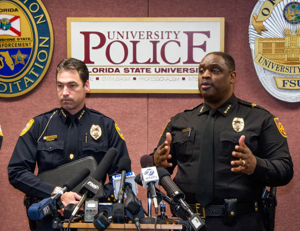 Tallahassee police chief Michael Deleo (L) and FSU police chief David Perry talk with the media about a shooting outside the Strozier library on the Florida State University campus in Tallahassee, Fla., Thursday, Nov 20, 2014. Three students were wounded and the gunman was shot and killed by police officers. (AP Photo/Mark Wallheiser)